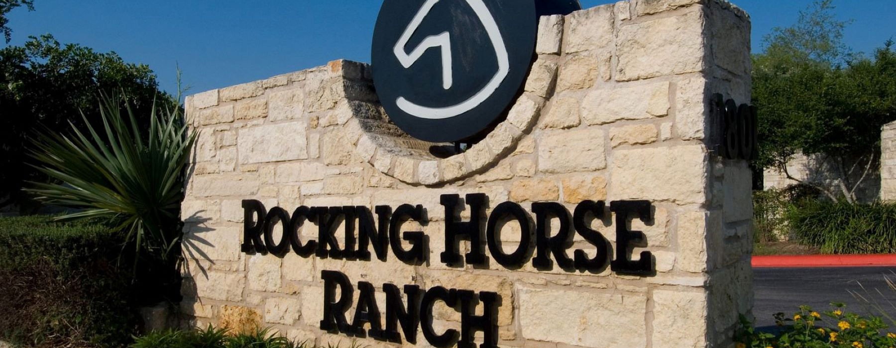 Large, Stone Rocking Horse Ranch Entrance sign