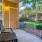 Apartment patio facing a grassy courtyard