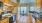 Kitchen open to dining space with large windows for natural light