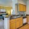 Kitchen with a breakfast bar that opens to the living room