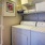 Large laundry room with side-by-side washer and dryer