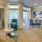 Large, open living room with dining space and glass doors opening to patio